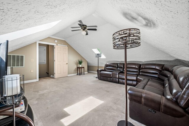 1712 Lake Grassland W, Gallatin, TN 37066 - living room with lofted ceiling with skylight, a ceiling fan, a textured ceiling, carpet, and baseboards