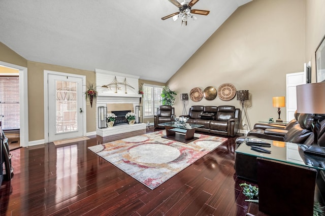 1712 Lake Grassland W, Gallatin, TN 37066 - living room with baseboards, a fireplace with raised hearth, wood finished floors, and a ceiling fan
