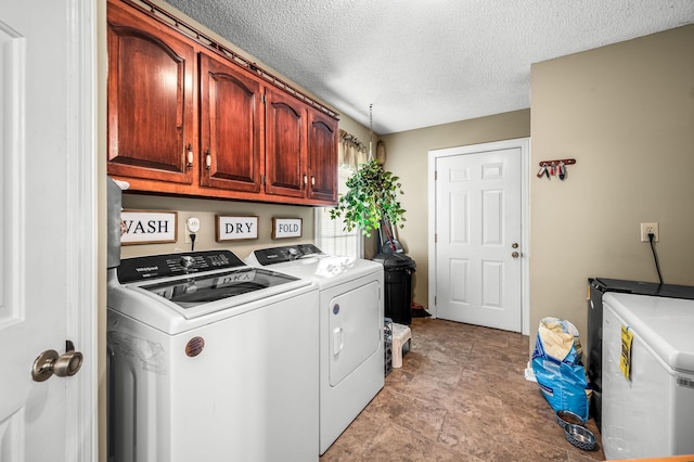 1712 Lake Grassland W, Gallatin, TN 37066 - clothes washing area with a textured ceiling, cabinet space, and washing machine and clothes dryer