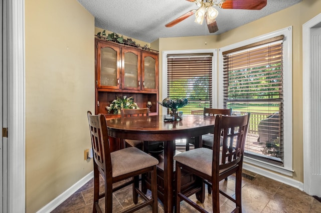 1712 Lake Grassland W, Gallatin, TN 37066 - dining room with visible vents, baseboards, a textured ceiling, and a ceiling fan