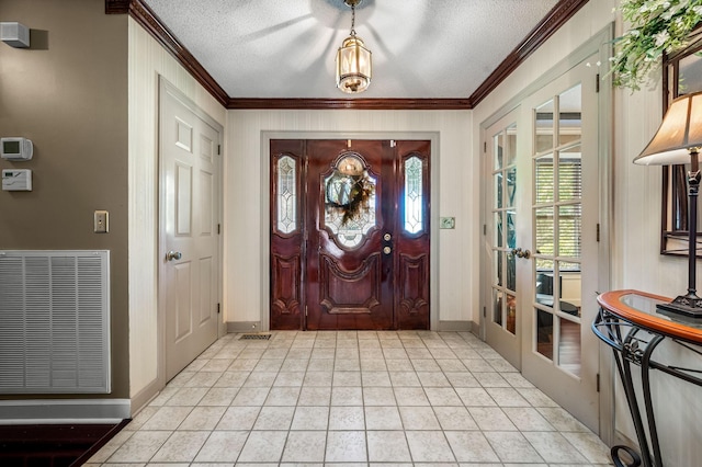 1712 Lake Grassland W, Gallatin, TN 37066 - foyer entrance with crown molding, baseboards, visible vents, and a textured ceiling