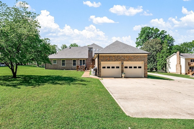 1712 Lake Grassland W, Gallatin, TN 37066 - view of front of property with a front yard, driveway, an attached garage, a shingled roof, and brick siding
