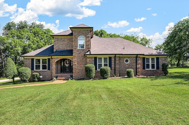 1712 Lake Grassland W, Gallatin, TN 37066 - view of front of house featuring brick siding, roof with shingles, and a front yard