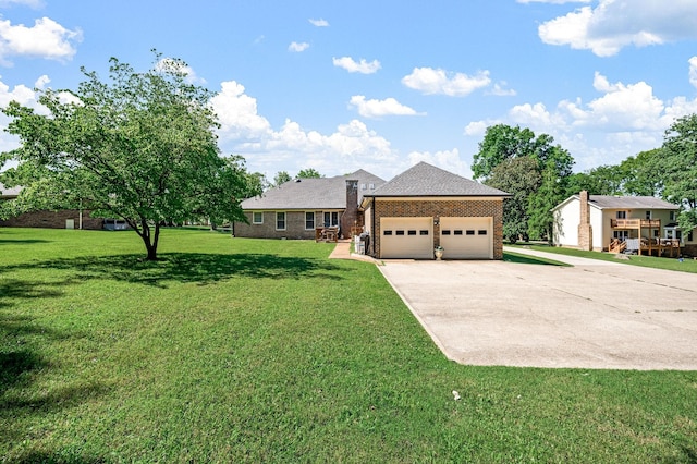 1712 Lake Grassland W, Gallatin, TN 37066 - ranch-style house featuring brick siding, driveway, an attached garage, and a front lawn