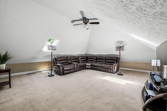 1712 Lake Grassland W, Gallatin, TN 37066 - carpeted living area with lofted ceiling with skylight, a ceiling fan, baseboards, and a textured ceiling