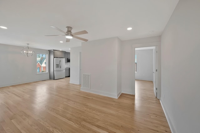 1815 Martin St Unit A, Nashville, TN 37203 - unfurnished living room with a chandelier, a ceiling fan, light wood-style flooring, and recessed lighting