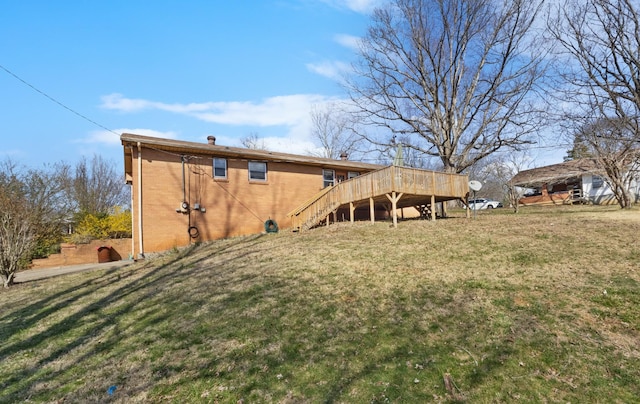 view of yard with stairs and a deck