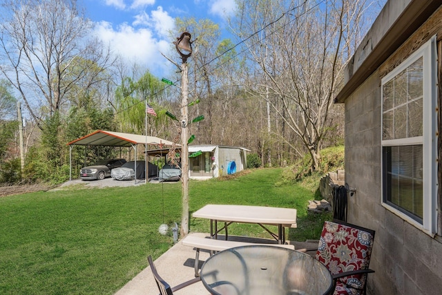 4897 Sulphur Creek Rd, Nashville, TN 37218 - view of yard featuring an outbuilding, outdoor dining space, and a carport