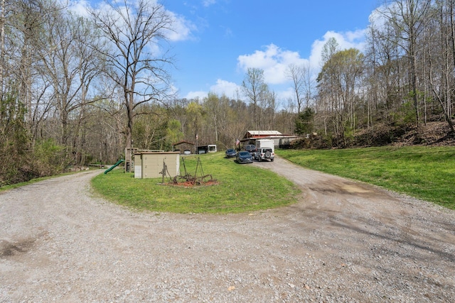 4897 Sulphur Creek Rd, Nashville, TN 37218 - view of road with dirt driveway and a wooded view