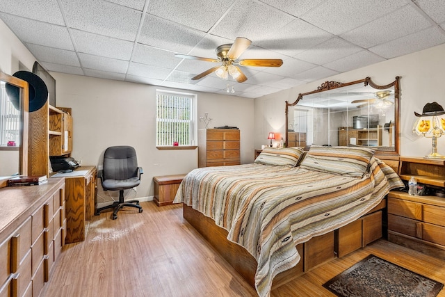 4897 Sulphur Creek Rd, Nashville, TN 37218 - bedroom with baseboards, ceiling fan, a drop ceiling, and light wood-style floors