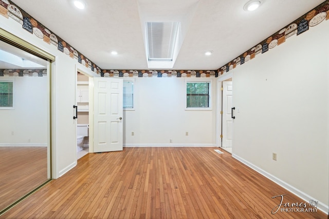 spare room with recessed lighting, baseboards, and light wood-style flooring