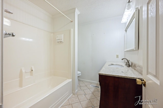 bathroom with tile patterned floors, toilet, shower / tub combination, a textured ceiling, and vanity