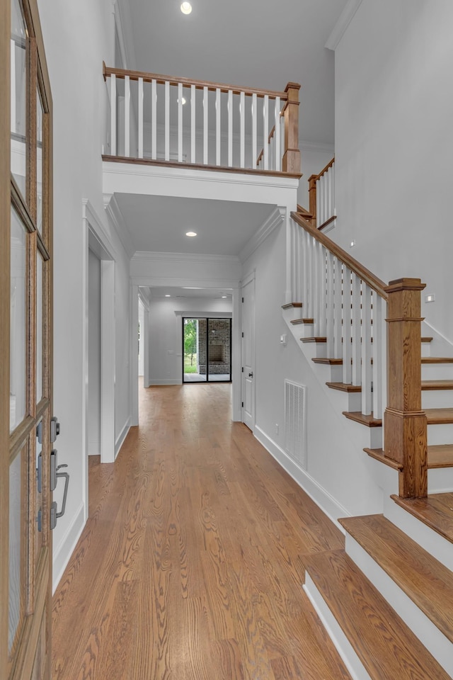 7004 Twelve Corners Rd, Lascassas, TN 37085 - foyer featuring crown molding, wood finished floors, stairs, baseboards, and recessed lighting
