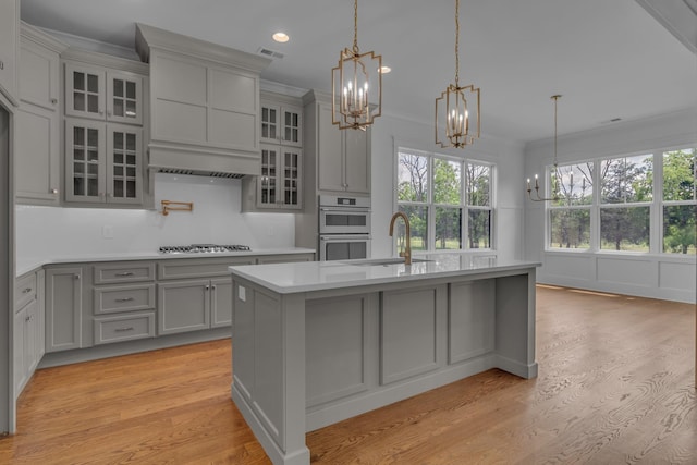 7004 Twelve Corners Rd, Lascassas, TN 37085 - kitchen with gray cabinetry, a sink, a chandelier, light wood-style flooring, and recessed lighting