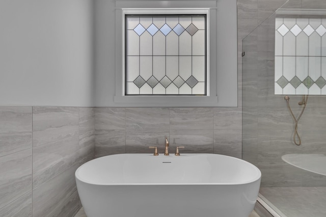 7004 Twelve Corners Rd, Lascassas, TN 37085 - full bath with tile walls, a freestanding bath, and a tile shower