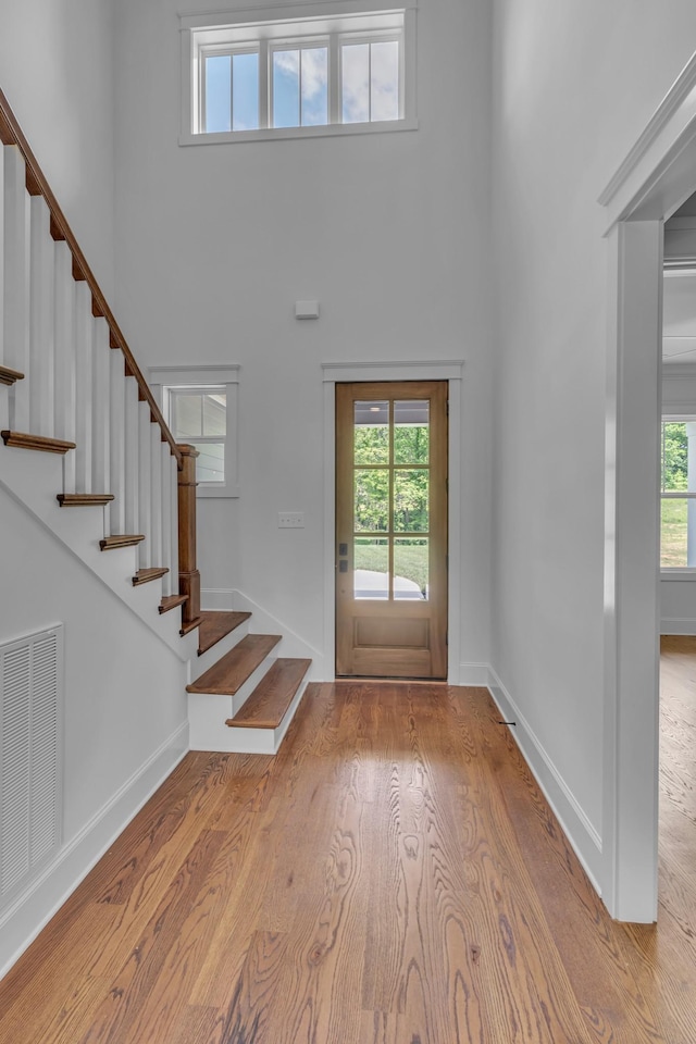 7004 Twelve Corners Rd, Lascassas, TN 37085 - entryway with a towering ceiling, stairway, wood finished floors, and baseboards