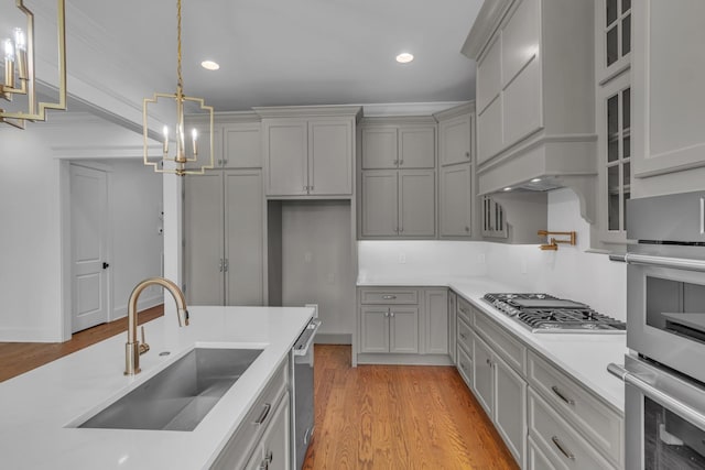 7004 Twelve Corners Rd, Lascassas, TN 37085 - kitchen with a sink, gray cabinets, stainless steel appliances, a chandelier, and recessed lighting