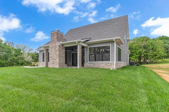 7004 Twelve Corners Rd, Lascassas, TN 37085 - rear view of house with a ceiling fan, a lawn, central AC, and brick siding