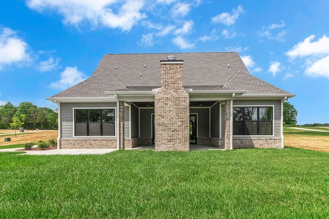 7004 Twelve Corners Rd, Lascassas, TN 37085 - rear view of house with brick siding, a lawn, a shingled roof, and a chimney