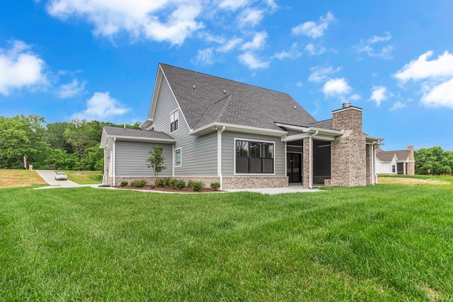 7004 Twelve Corners Rd, Lascassas, TN 37085 - back of property with a lawn, a chimney, brick siding, and a shingled roof