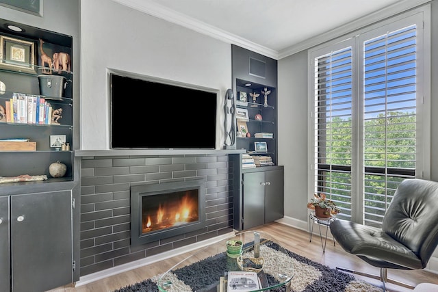 155 Harpeth Trace Smt, Nashville, TN 37221 - living area with a brick fireplace, crown molding, wood finished floors, baseboards, and built in features