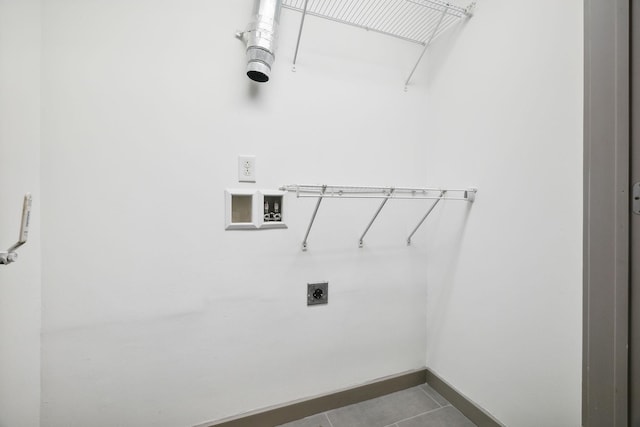 clothes washing area with hookup for a washing machine, hookup for an electric dryer, baseboards, tile patterned flooring, and laundry area