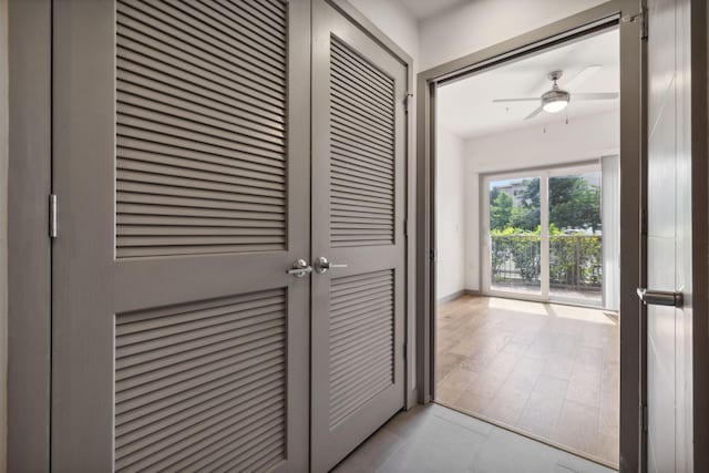 interior space featuring a ceiling fan and baseboards