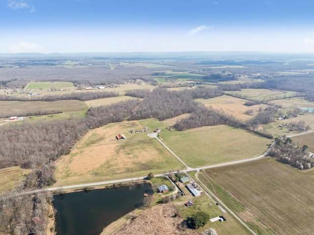 birds eye view of property featuring a rural view and a water view