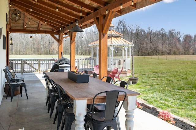 view of patio / terrace featuring a gazebo and outdoor dining area