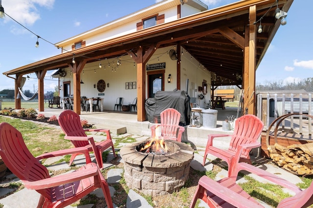 view of patio / terrace featuring area for grilling and an outdoor fire pit