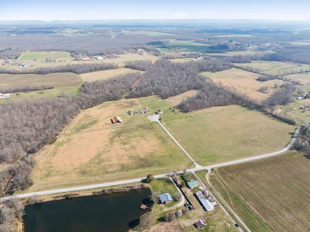 birds eye view of property featuring a rural view and a water view