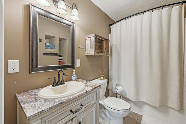 full bathroom with toilet, shower / tub combo with curtain, a textured ceiling, tile patterned flooring, and vanity