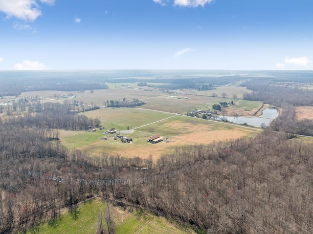 birds eye view of property with a rural view and a water view