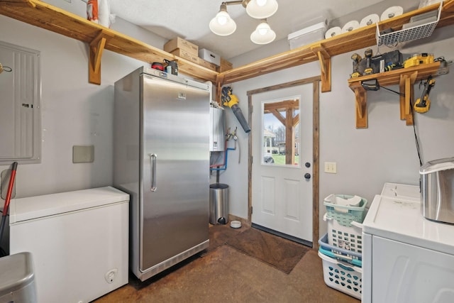 laundry area with electric panel, laundry area, and washing machine and dryer