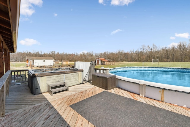 pool with a yard and a wooden deck
