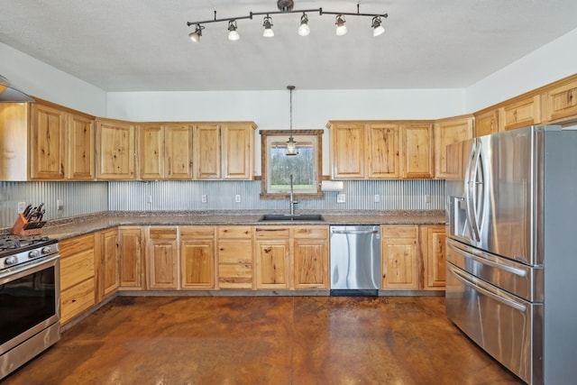 kitchen with light brown cabinetry, a sink, decorative light fixtures, finished concrete flooring, and stainless steel appliances