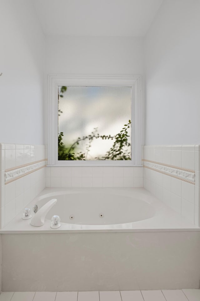 full bathroom featuring a jetted tub