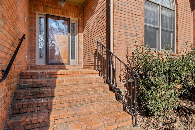 entrance to property with brick siding