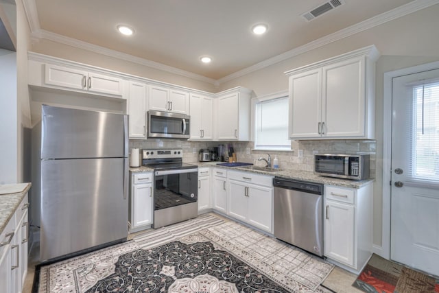 105 David Bolin Dr, La Vergne, TN 37086 - kitchen with visible vents, backsplash, appliances with stainless steel finishes, and white cabinetry