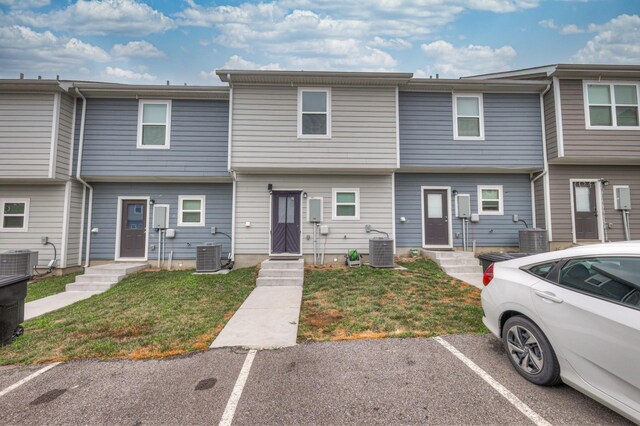 105 David Bolin Dr, La Vergne, TN 37086 - townhome / multi-family property with a front yard, central AC unit, and uncovered parking
