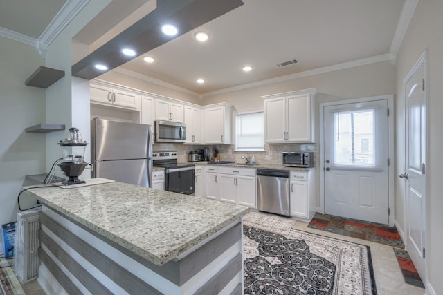 105 David Bolin Dr, La Vergne, TN 37086 - kitchen with white cabinets, visible vents, appliances with stainless steel finishes, and ornamental molding