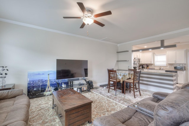 105 David Bolin Dr, La Vergne, TN 37086 - living area with baseboards, a ceiling fan, and crown molding