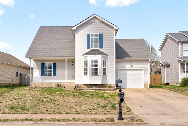 traditional-style home with driveway, roof with shingles, an attached garage, and fence