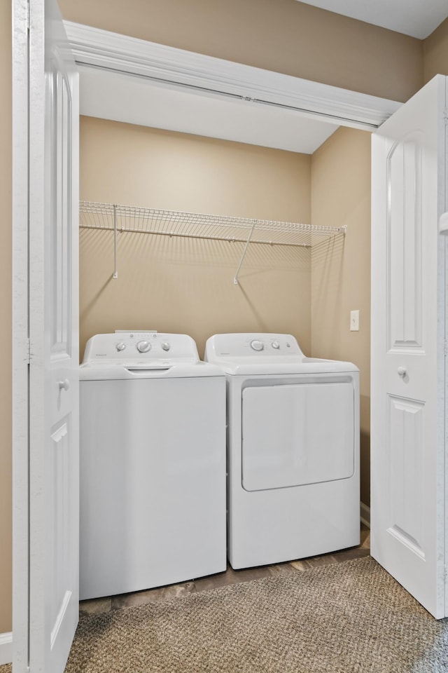laundry area with laundry area and separate washer and dryer