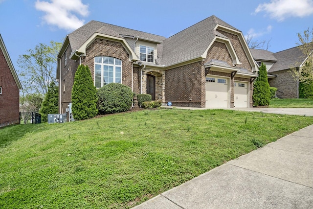 2821 Brentwood Knoll Ct, Nashville, TN 37211 - view of front of property featuring brick siding, driveway, a shingled roof, and a front lawn