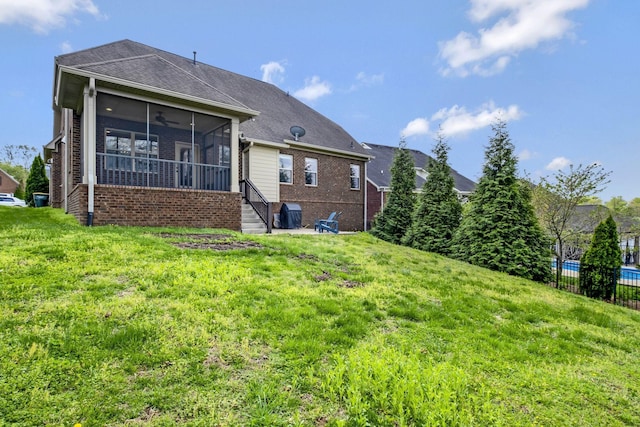 2821 Brentwood Knoll Ct, Nashville, TN 37211 - back of property with a sunroom, brick siding, a ceiling fan, and roof with shingles