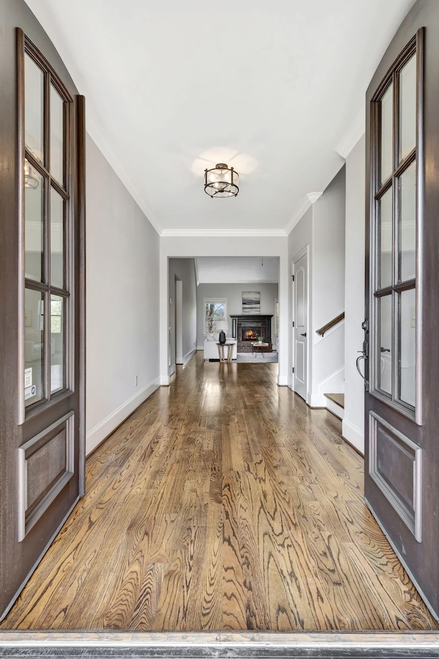 2821 Brentwood Knoll Ct, Nashville, TN 37211 - foyer featuring stairs, crown molding, wood finished floors, baseboards, and a lit fireplace
