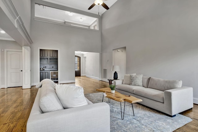 2821 Brentwood Knoll Ct, Nashville, TN 37211 - living room with ceiling fan, wood finished floors, baseboards, crown molding, and wine cooler