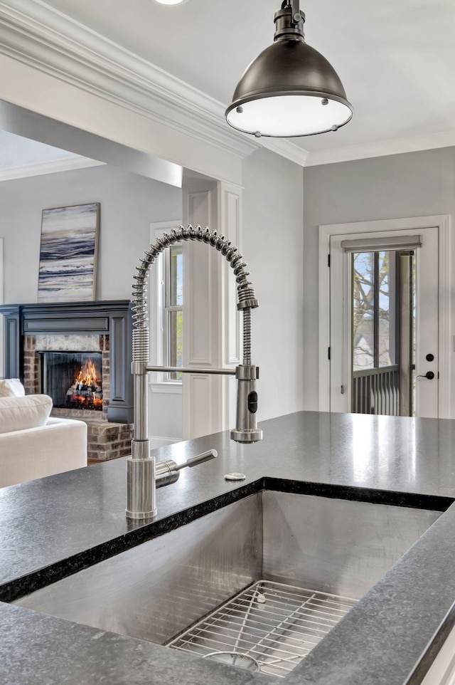 2821 Brentwood Knoll Ct, Nashville, TN 37211 - kitchen view of crown molding, dark countertops, a fireplace, and a sink