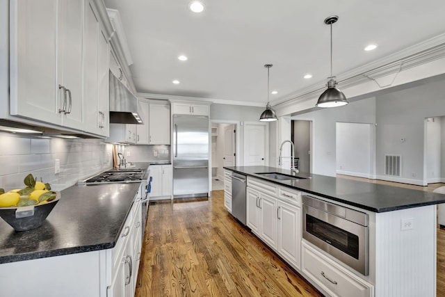 2821 Brentwood Knoll Ct, Nashville, TN 37211 - kitchen with built in appliances, a sink, ornamental molding, dark countertops, and dark wood-style floors